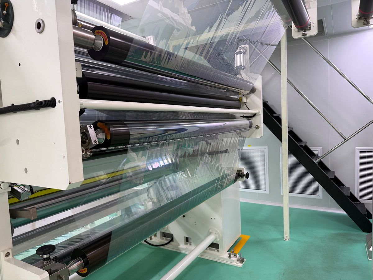 Film running through precision rollers on the production line