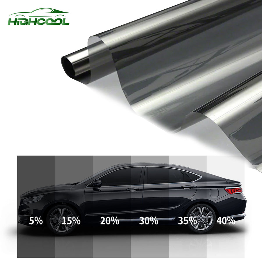 Roll of automotive window film above a shade chart on a car side window
