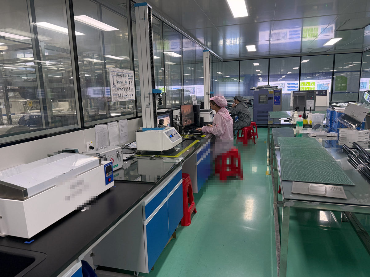 Quality control laboratory with technicians testing film