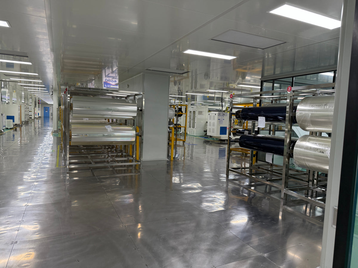 Film rolls and production equipment inside the workshop, from HIGHCOOL's existing factory photo archive